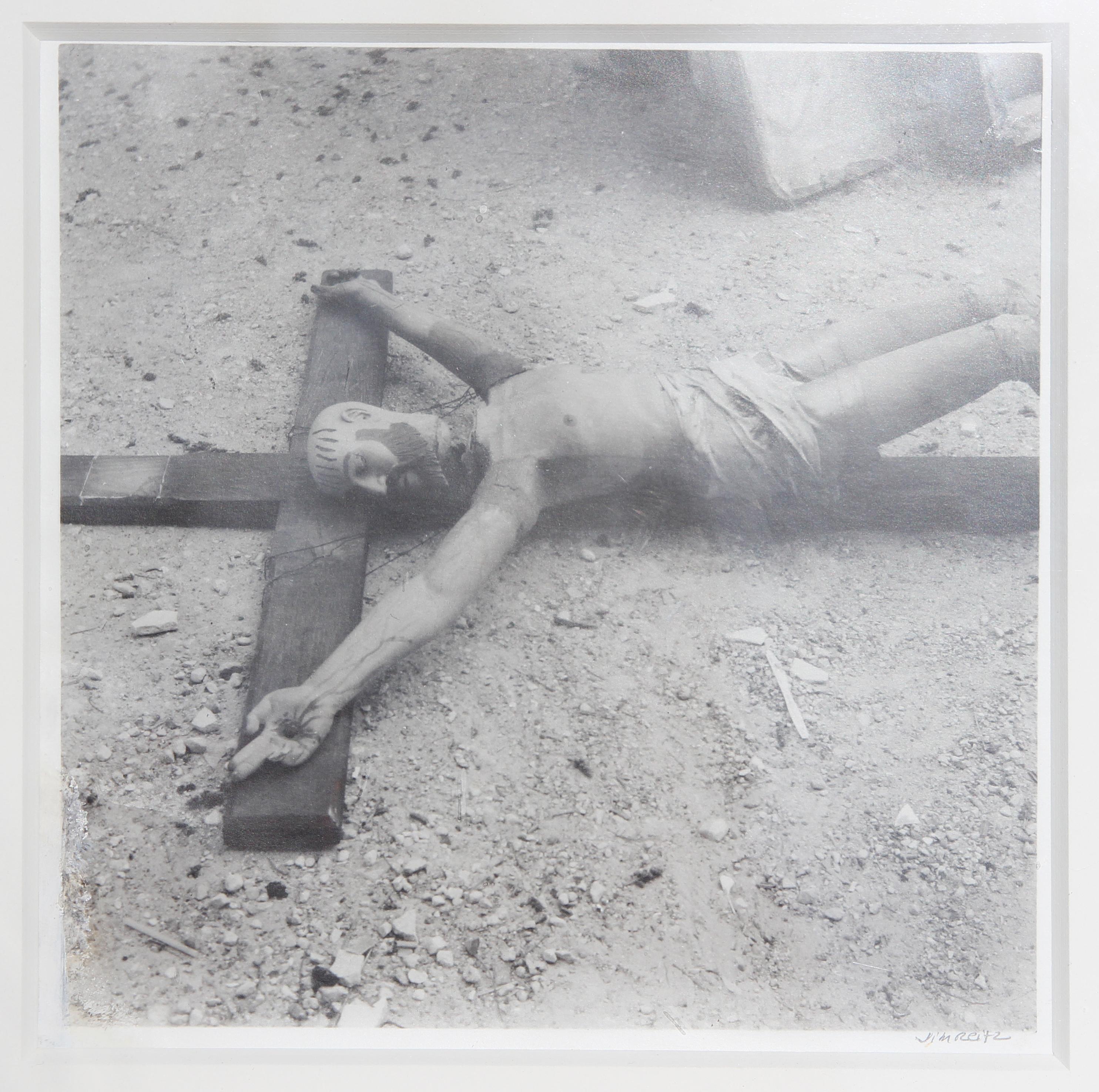 Black and White Photograph of a Found Crucifix Sculpture on the Ground - Gray Still-Life Photograph by Jim Reitz