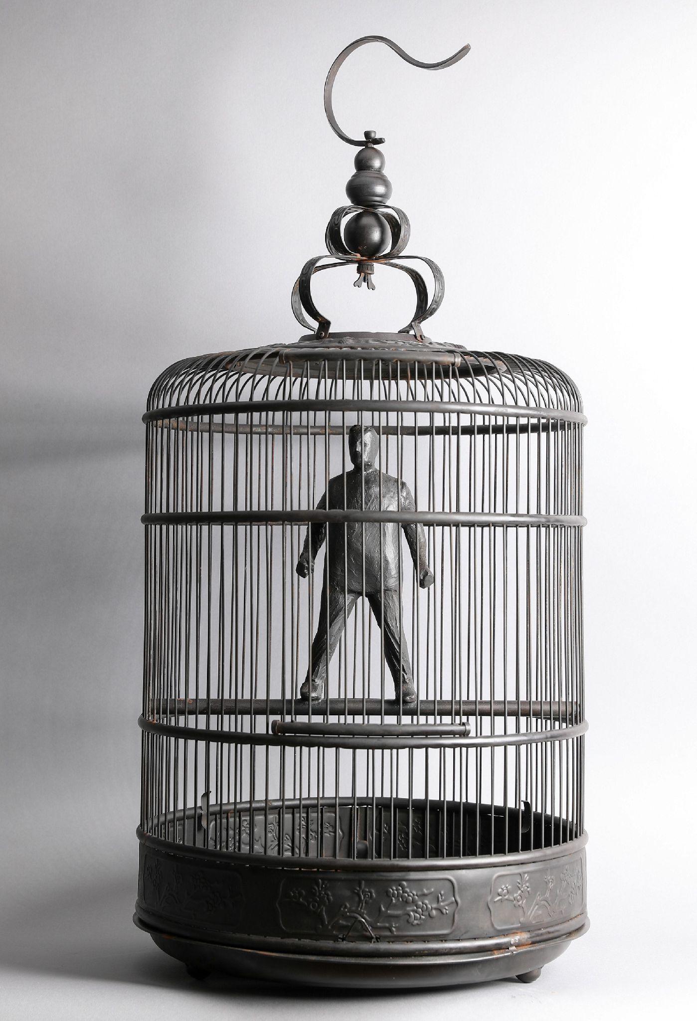 Jim Rennert Figurative Sculpture - Caged, not Conquered