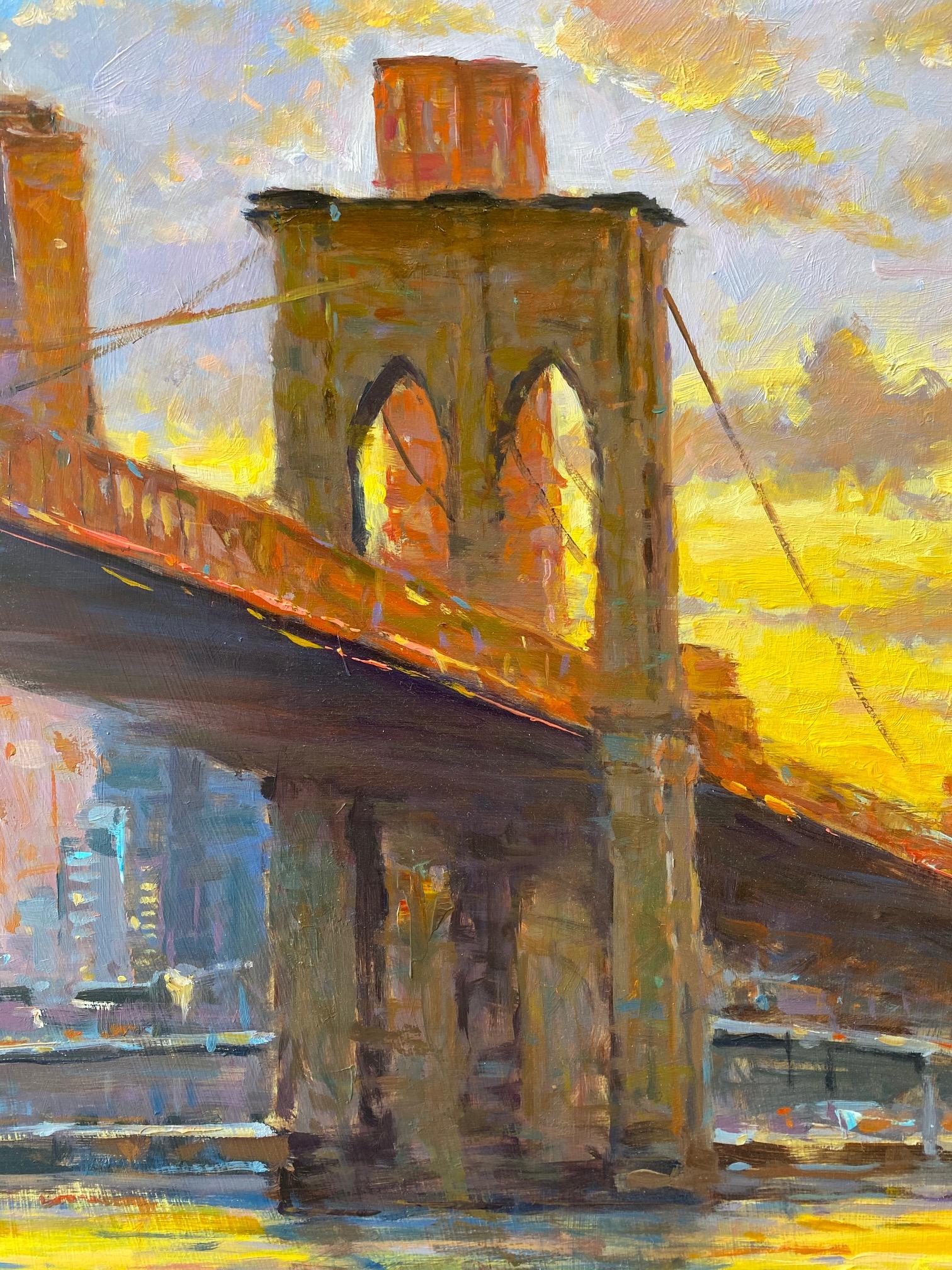 The glow of the sunset at the iconic Brooklyn Bridge of NYC radiates out upon the Freedom Tower and the East River. As the renaissance of Brooklyn, New York is blooming, the connection that the Brooklyn Bridge provides between Brooklyn and the