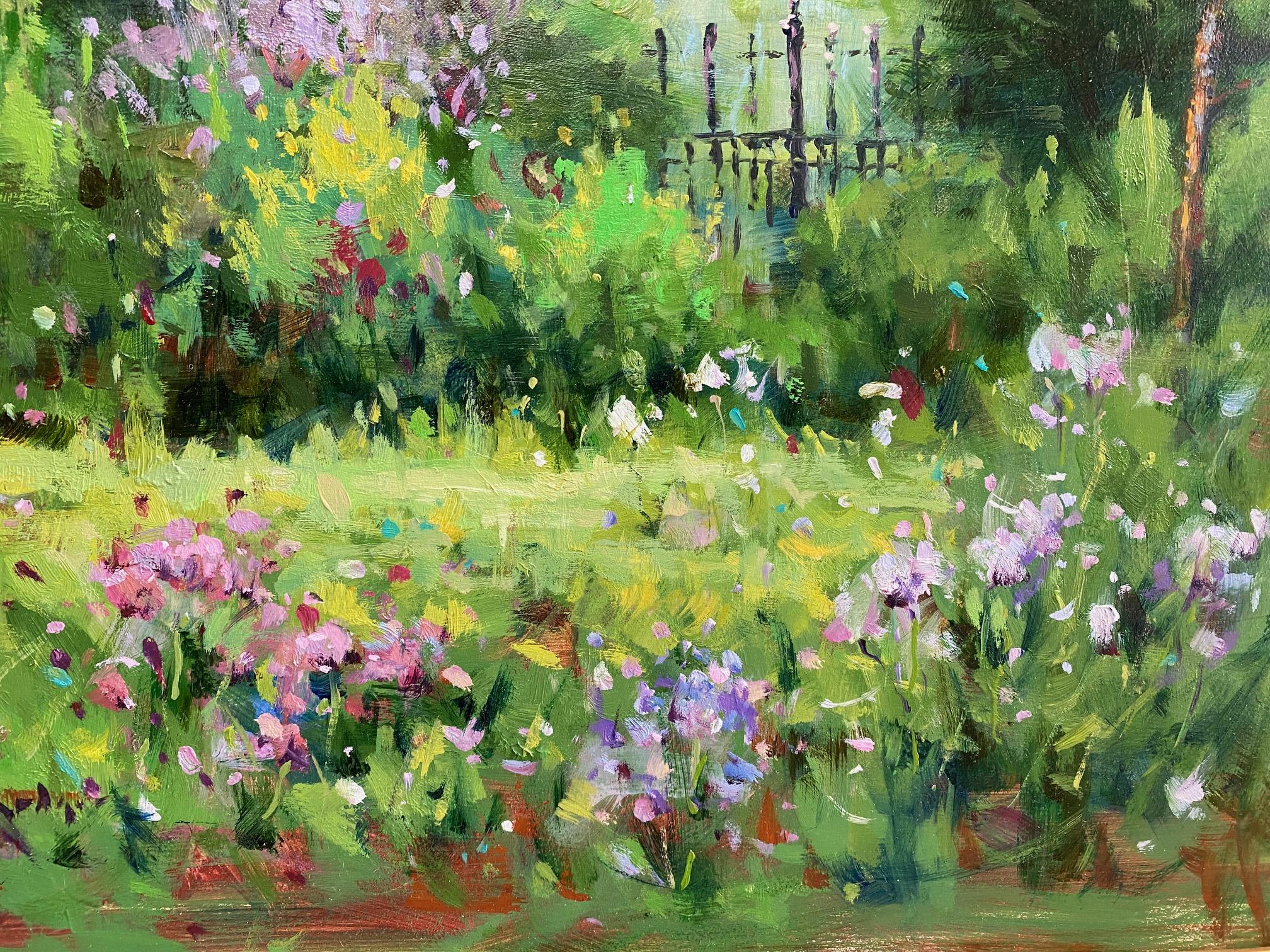 On a lovely spring day the newly planted florals with some sumptuous wildflowers mixed in, feel their way through the lush green grass, delighting us with their random appearance as the old wrought iron garden gate takes a prominent spot in the