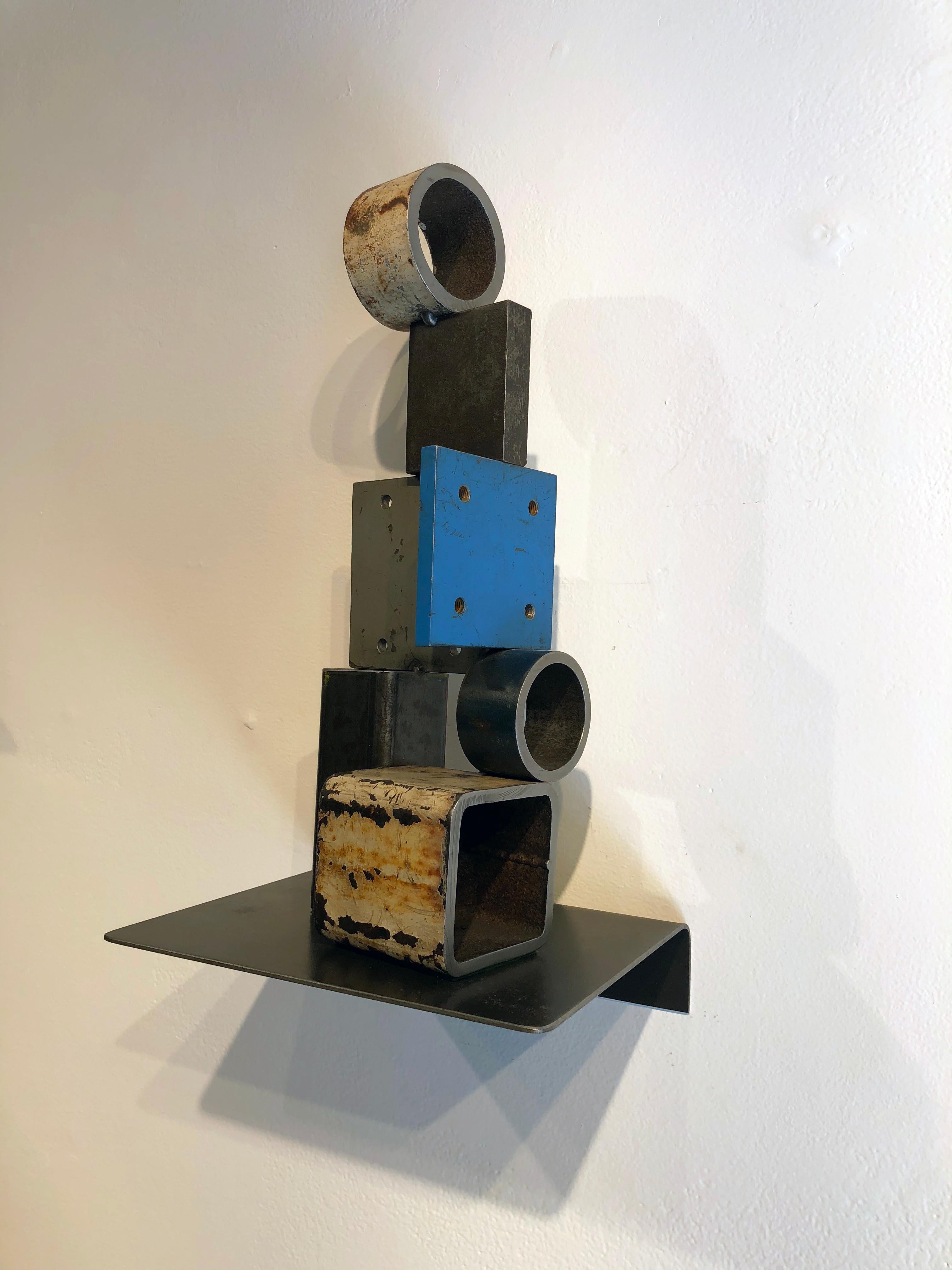 This is a welded steel sculpture made by Wisconsin based artist Jim Rose.  Using the same salvaged steel found in his renowned furniture, Jim combines various pieces of salvaged steel, taking advantage of the original painted and textured surfaces,