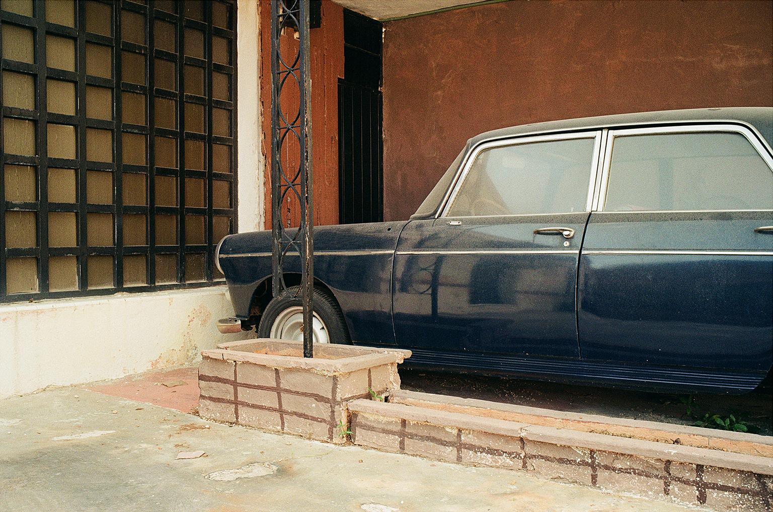 Peugeot, Merida, Mexico, - Black Landscape Photograph by Jim Ryce
