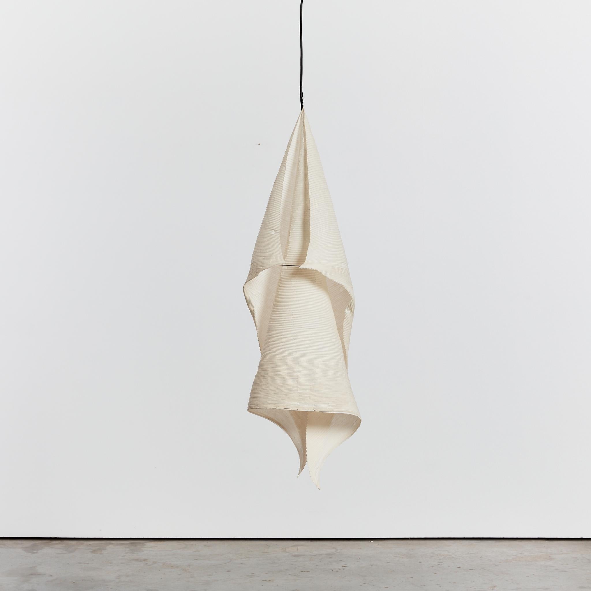 The delicate sculptural 'Jimken' pendant lamp by Ingo Maurer. Featuring softly pleated rice paper, giving a subtle ambient light.

Part of the lighting series 'MaMo Nouchies', which Ingo Maurer developed together with the designer Dagmar Mombach.