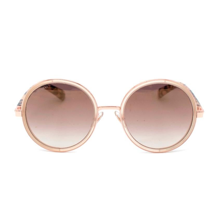 Jimmy Choo Glittered Rose Gold Round Sunglasses
 

 -These Jimmy Choo sunglasses truly reflects the label's signature craftsmanship and glamorous appeal.
 - Designed in a rounded silhouette, this pair has acetate and gold-plated metal body with pink