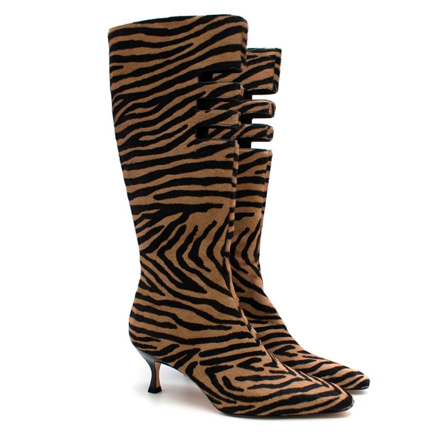 Jimmy Choo animal print calf hair boots

- fur outer - kitten heel - calf high - cut out sections on the front - pointed toe - zip up fastening at the back - spare heel tips included

Please note, these items are pre-owned and may show signs of