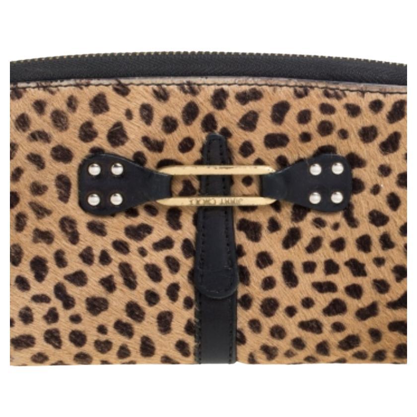 This Jimmy Choo wallet is grand and stylish. Crafted from animal-printed calfhair and leather, it comes in shades of brown and black. It is styled with gold-tone hardware, well-lined interior and impeccable finishing.