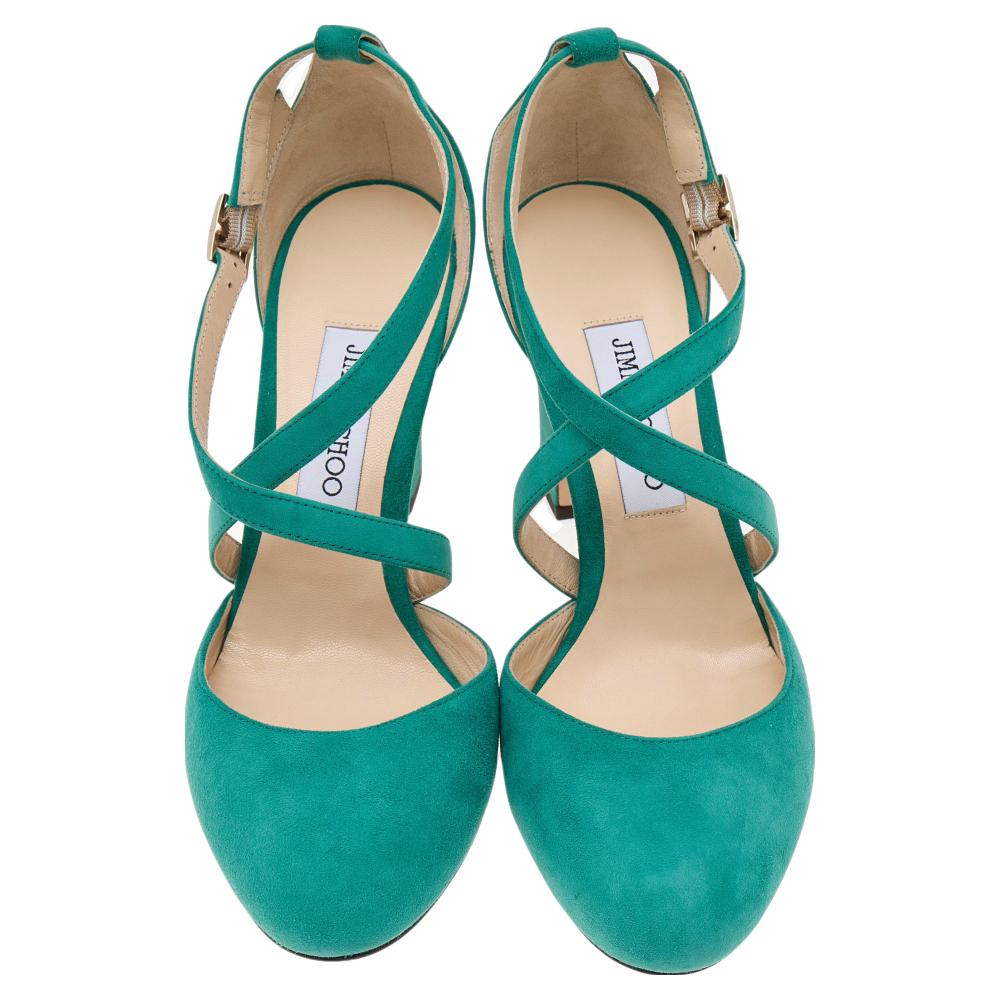 These Cleo 85 sandals from the House of Jimmy Choo are absolutely gorgeous! They are made from aqua blue suede on the exterior and exhibit covered toes, gold-toned hardware, and block heels. They feature a buckle-type closure. Match these sandals