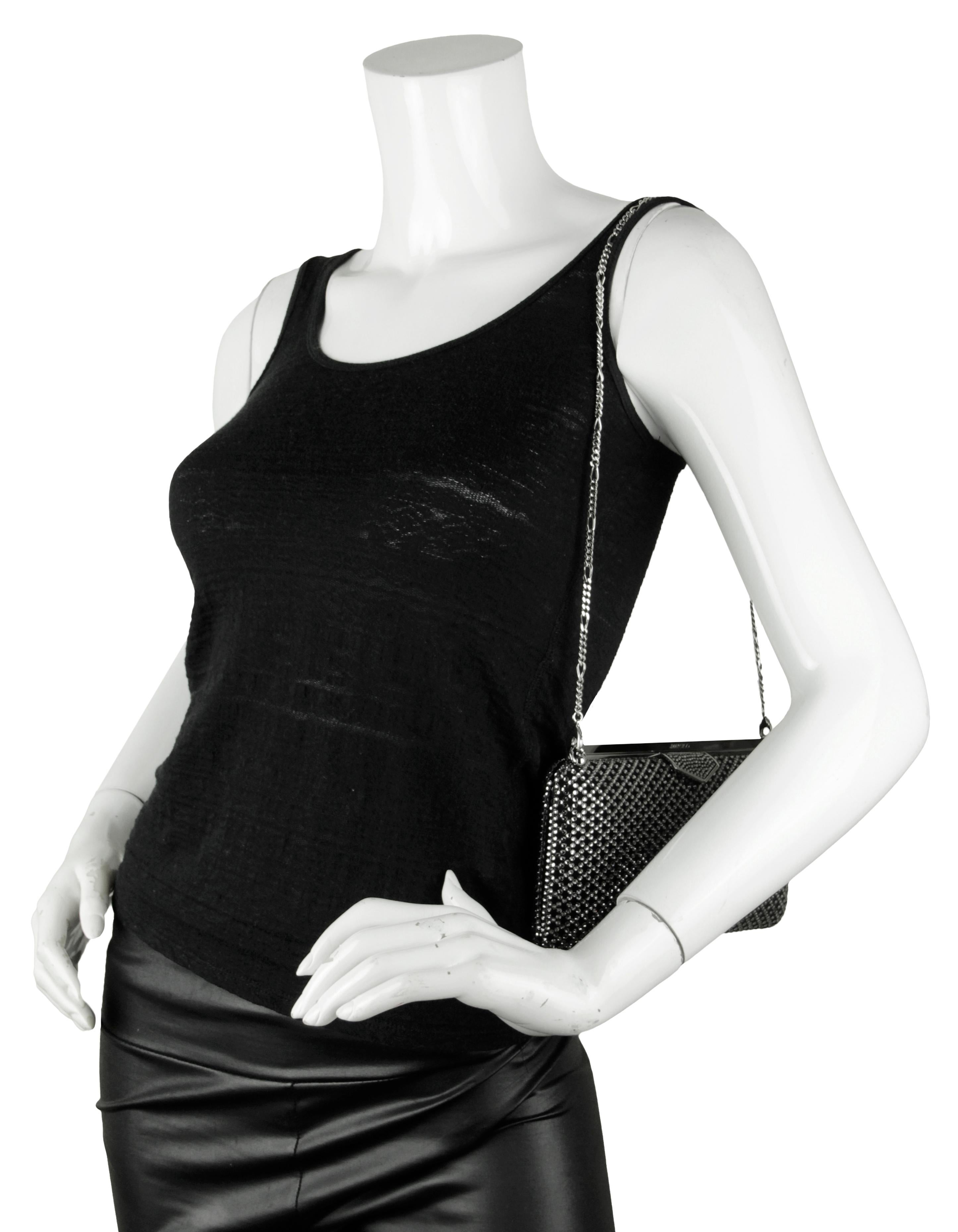 Jimmy Choo Ellipse Crystal-Embellished Clutch /Shoulder Bag. Features diamond motif grey crystal on black suede. Chain strap can be removed to be worn as a clutch bag. 

Made In: Italy
Color: Black and grey
Hardware: Silvertone
Materials: Suede,