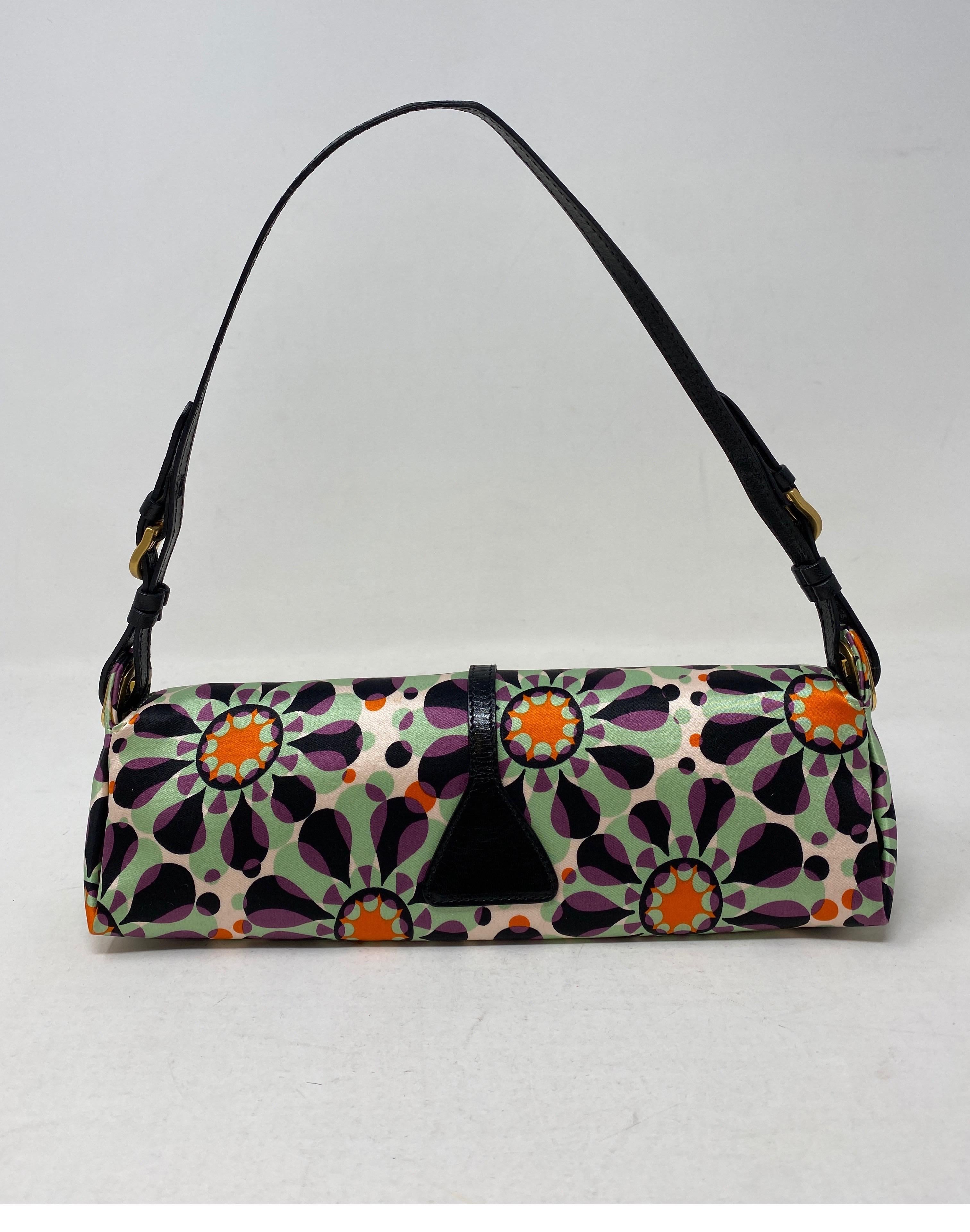 Jimmy Choo purse in groovy psychedelic print. Satin in pristine condition with gold hardware and leather strap. Baguette style bag. On trend now. Whimsical and fun bag. Guaranteed authentic. 
