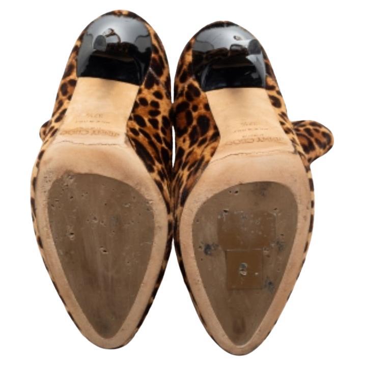 Nail a confident look with these designer ankle boots from Jimmy Choo! They're made of leopard-print calf hair and added with a back zip closure, leather lining, and 11.5 cm heels.