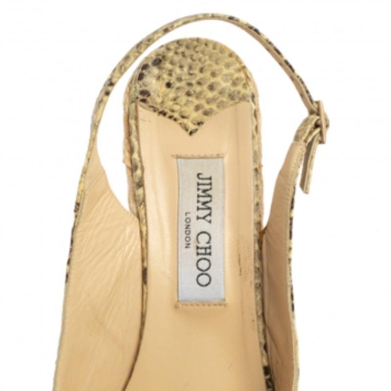 Get these Polar sandals home today, crafted by the house of Jimmy Choo. Having slender front straps, the sandals have wedge heels accented with espadrille details which give an extremely contemporary look to the piece. They are made from python