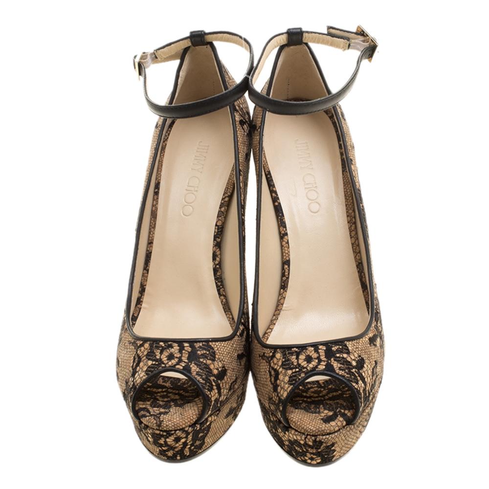 Dress it up for the formal parties and ease it down for the day time events, these Jimmy Choo pumps are a must have for style with comfort. Constructed in beige leather and cork wedge heels, these shoes feature a black lace covering all over along