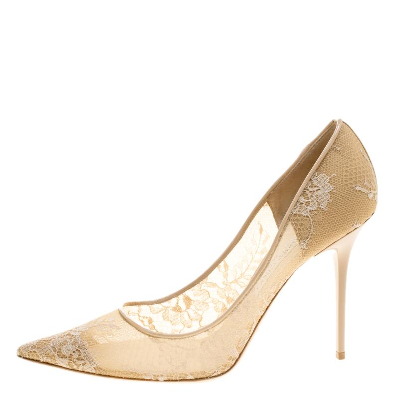 Add a touch of glamour to your look by slipping into this pair of sparkling beige pumps. Jimmy Choo has always been known to churn out designs that become style statements just as this pair. Made with lace, mesh and patent leather trim, they sport