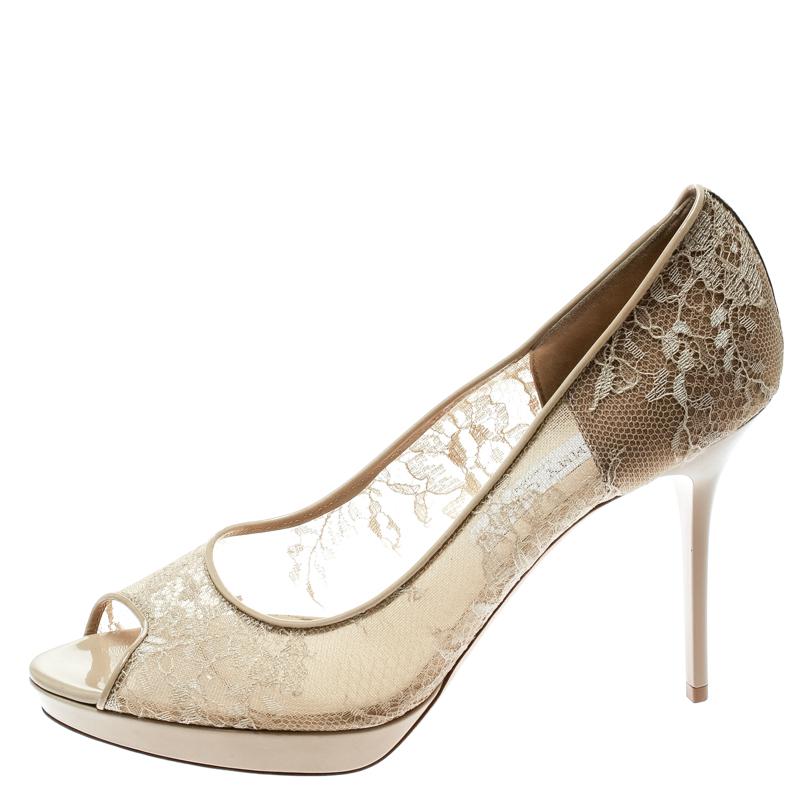 Lovely in beige, these Luna pumps from Jimmy Choo are here to make you fall in love with them! They have been crafted from lace, mesh and patent leather trims and styled with peep-toes. They come equipped with comfortable leather lined insoles, thin