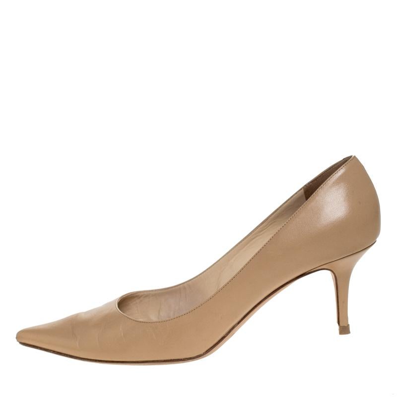 These Jimmy Choo pumps in beige are flowing with utmost wonder. They are covered in durable leather, styled with pointed toes and beautifully balanced on 7 cm heels. You'll love owning this pair!

Includes: Original Dustbag, Original Box

