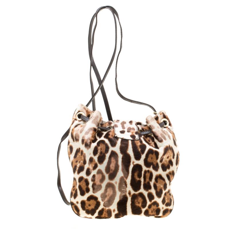 Versatile and practical, this crossbody bag from Jimmy Choo is absolutely delightful. The leopard printed bag is crafted from calfhair and features a leather shoulder strap. A flap secures the drawstring closure that opens to an Alcantara lined