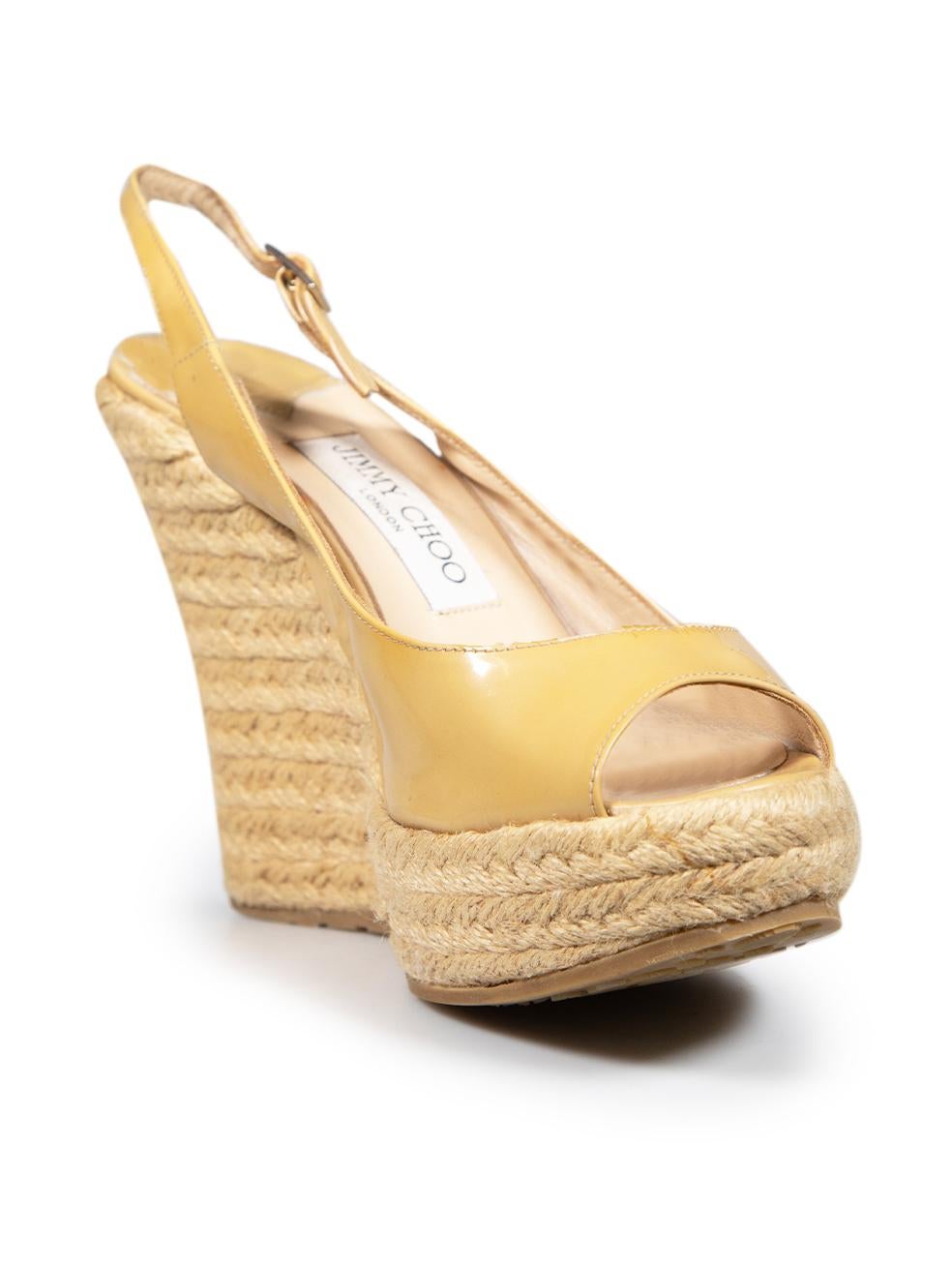 CONDITION is Good. Minor wear to heels is evident. The brand labels on the insoles are discoloured. The plastic is peeling along the edges and the seams. There are dried glue marks along the toe ends and sides of the wedges on this used Jimmy Choo