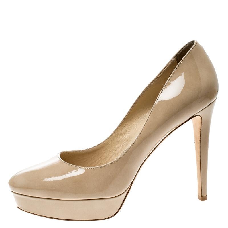 From the house of Jimmy Choo comes this gorgeous pair of pumps that is well-made and absolutely flaunt-worthy. They've been crafted from beige patent leather and styled with platforms, insoles meant to give you comfort and 12 cm heels to lift you