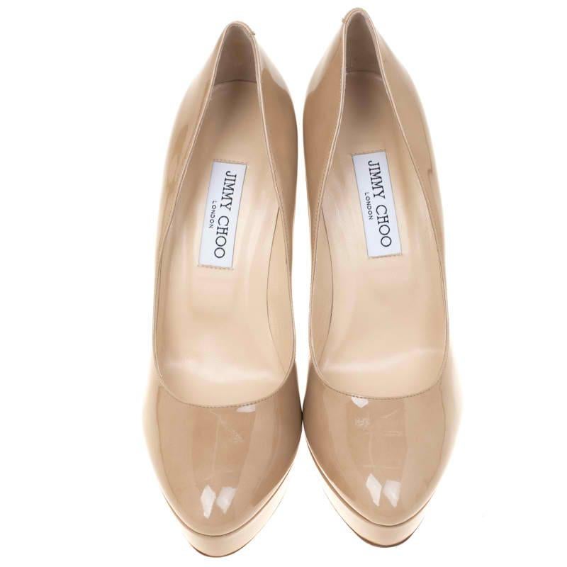 From the house of Jimmy Choo comes this gorgeous pair of pumps that is well-made and absolutely flaunt-worthy. They've been crafted from beige patent leather and styled with platforms, insoles meant to give you comfort and 12.5 cm heels to lift you