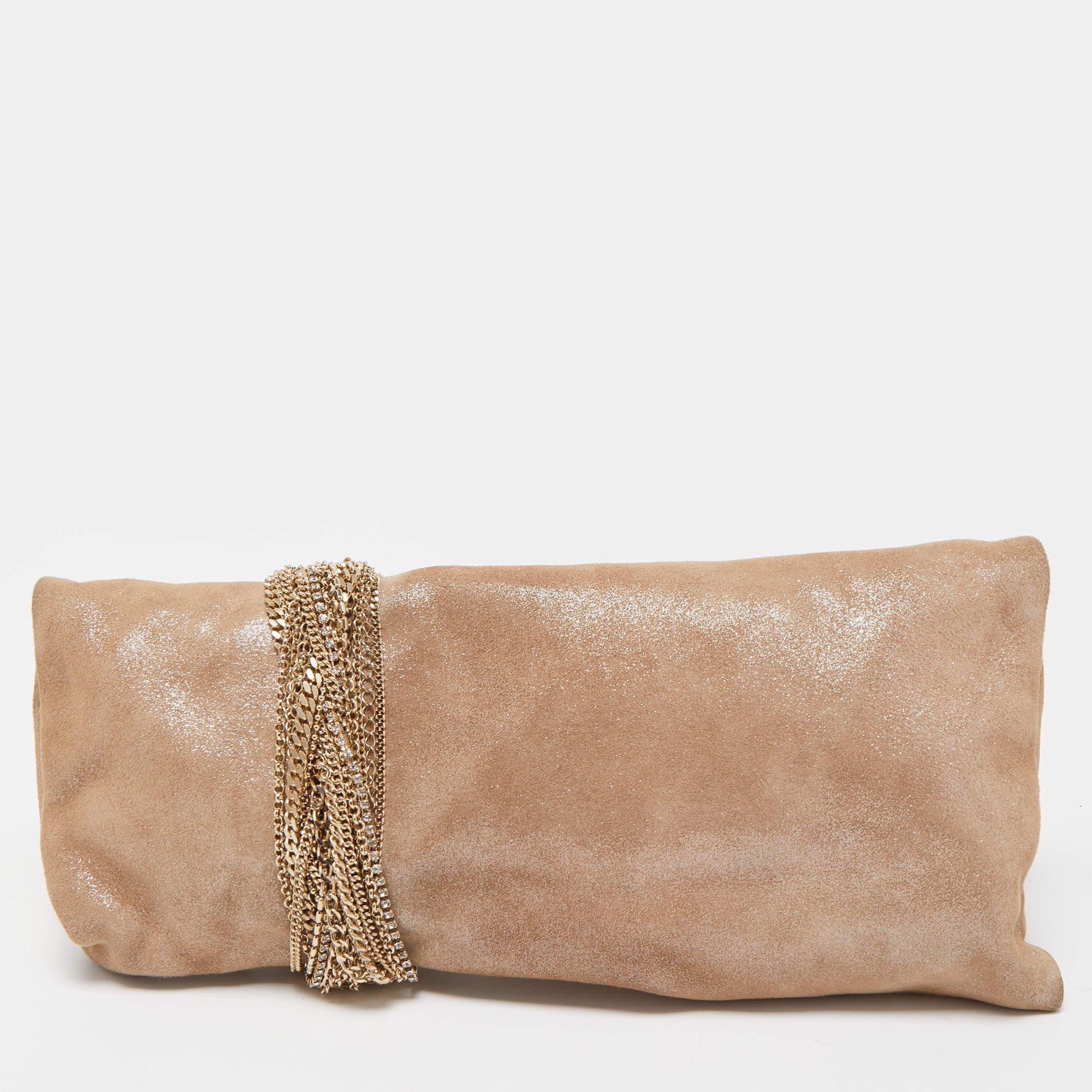 A classy and charming party accessory as attractive as this Chandra clutch will surely highlight your luxe taste in fashion. It is made of shimmering suede and elevated with signature chain detail.

Includes: Original Dustbag, Authenticity Card,