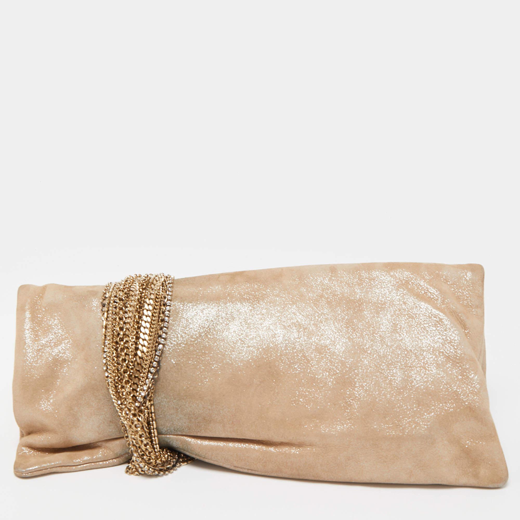 A classy and charming party accessory as attractive as this Chandra clutch will surely highlight your luxe taste in fashion. It is made of shimmering suede and elevated with signature chain detail.

Includes: Original Dustbag
