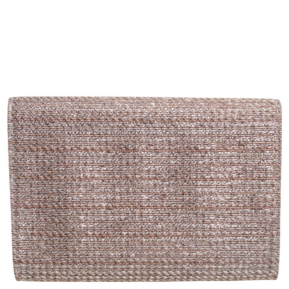 Jimmy Choo brings you yet another gorgeous accessory with this clutch. It has been crafted from beige & silver fabric and has a flap that reveals a well-sized interior. The lovely creation is complete with crystal embellishments on the front and