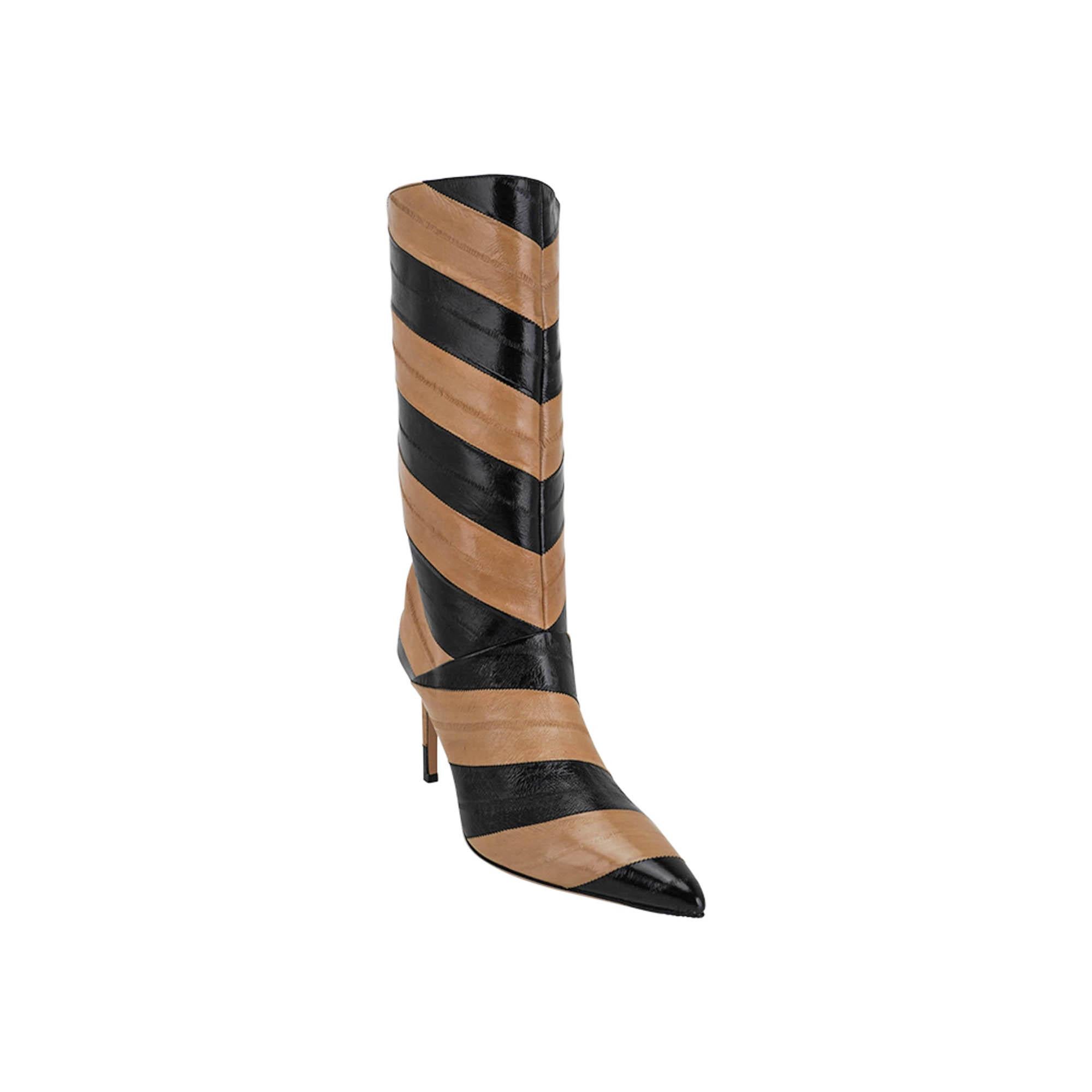 Mightychic offers a pair of Jimmy Choo Beren boots featured in Black and Cognac stipes.
Supple and soft eel skin.
Pointed toe with a stiletto heel.
Made in Italy. 
NEW or NEVER WORN.
final sale

SIZE: 38
USA SIZE  8

BOOT MEASURES:
HEEL  3.5