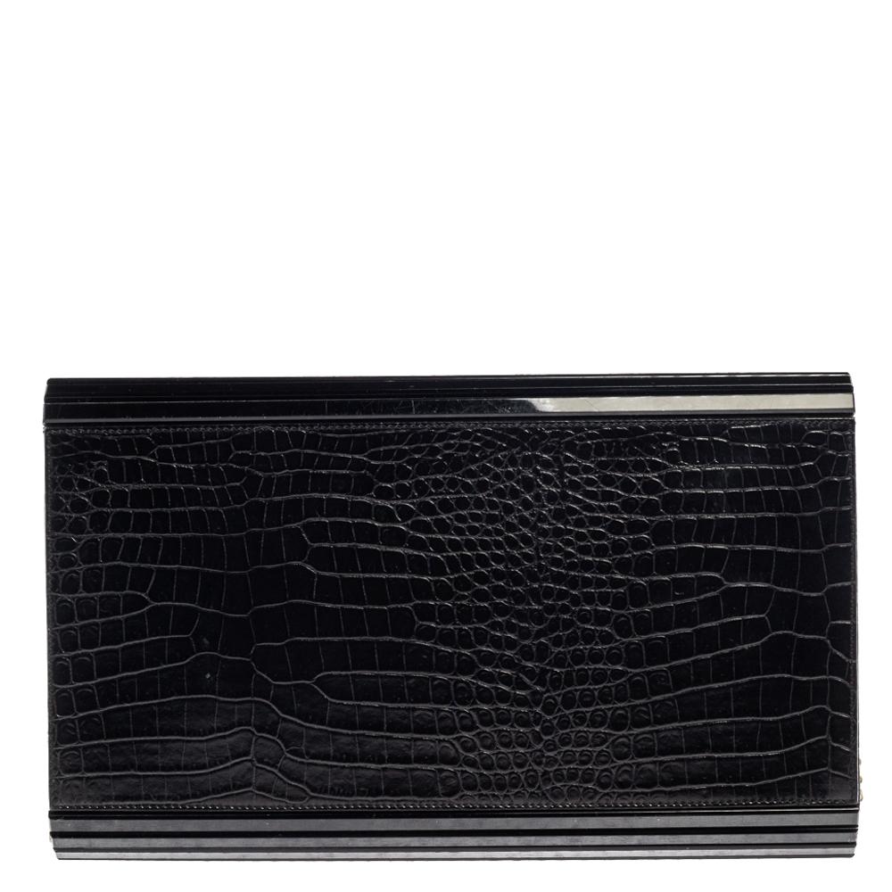 Add glamorous vibes to your look by carrying this gorgeous Candy clutch from Jimmy Choo! The black creation is crafted from acrylic and croc-embossed leather and styled with a front flap. It opens to a satin and leather interior that can easily