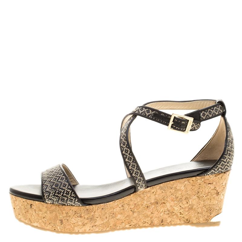 These sandals by Jimmy Choo are utterly mesmerizing and filled with so much beauty, they make our hearts flutter. They carry straps beautifully woven from fabric and straw along with ankle fastenings and cork wedges. They'll look great with dresses