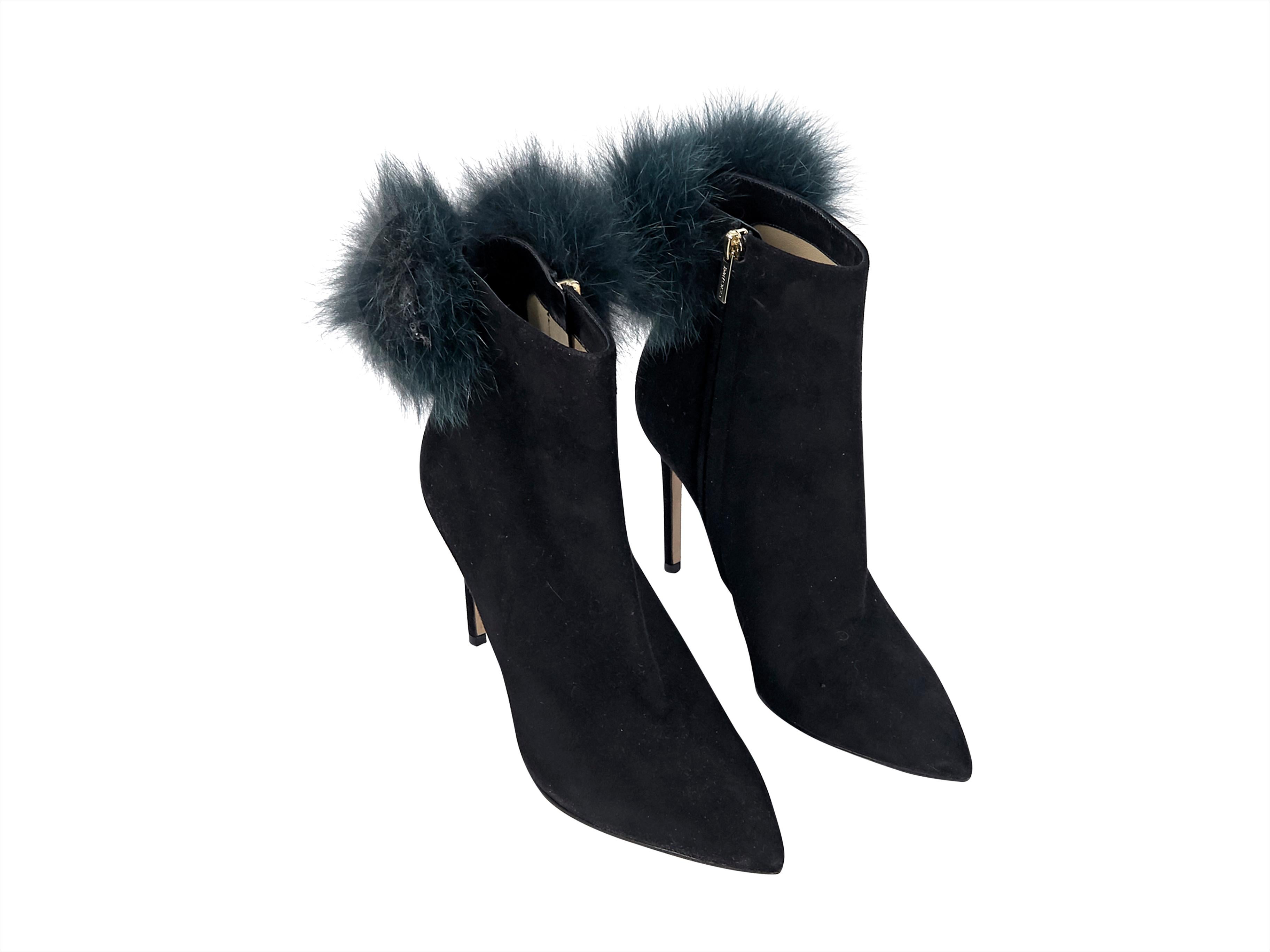 Product details: Black suede ankle boots by Jimmy Choo.  Accented with a fur pom pom.  Inner zip closure.  Point toe.  Label size IT 38.  4