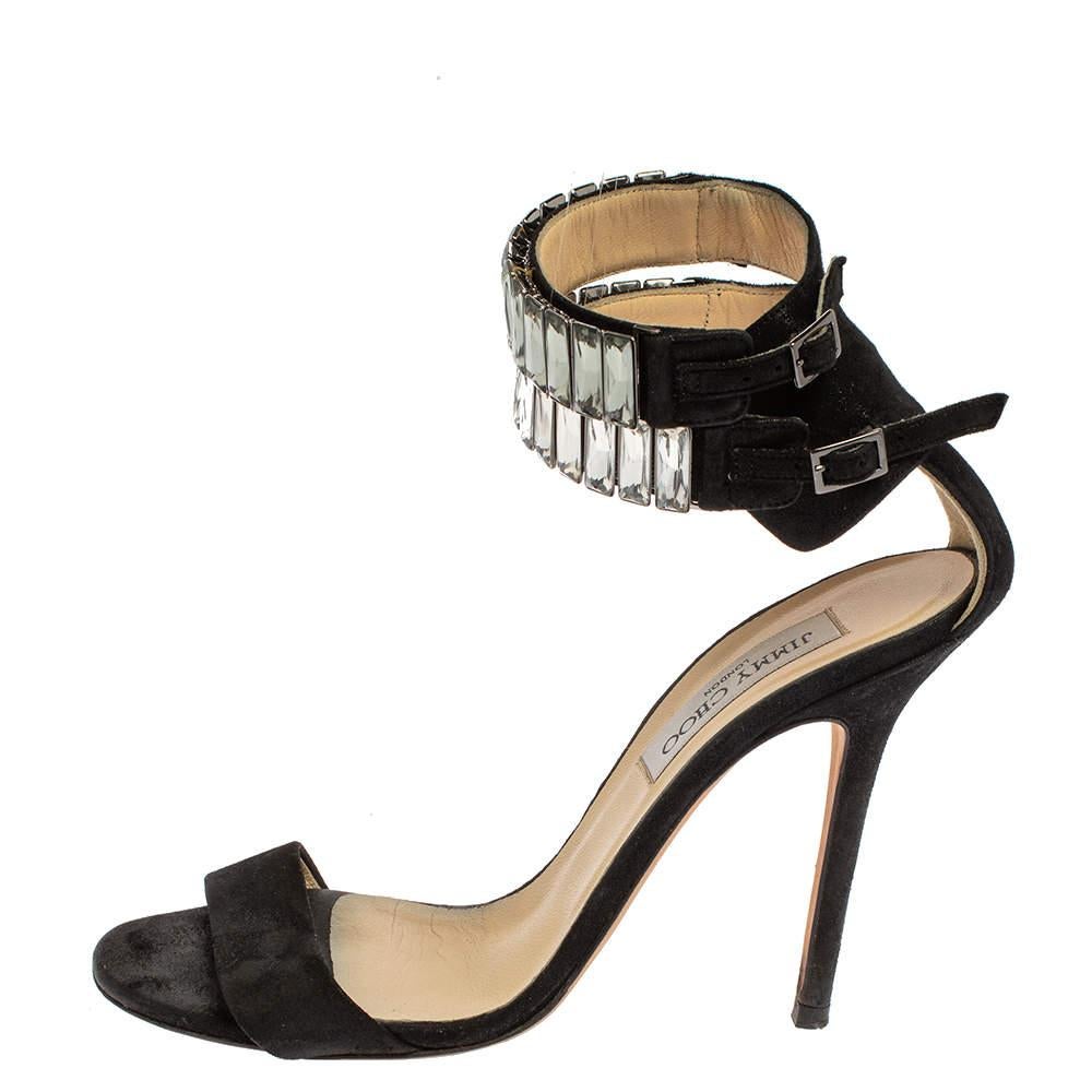You're sure to win hearts with these sandals from Jimmy Choo as they've been purposely created to make you feel like a fashion queen. The sandals carry a frontal strap, crystal-embellished ankle cuffs with buckle fastenings, and 11.5 cm heels. They
