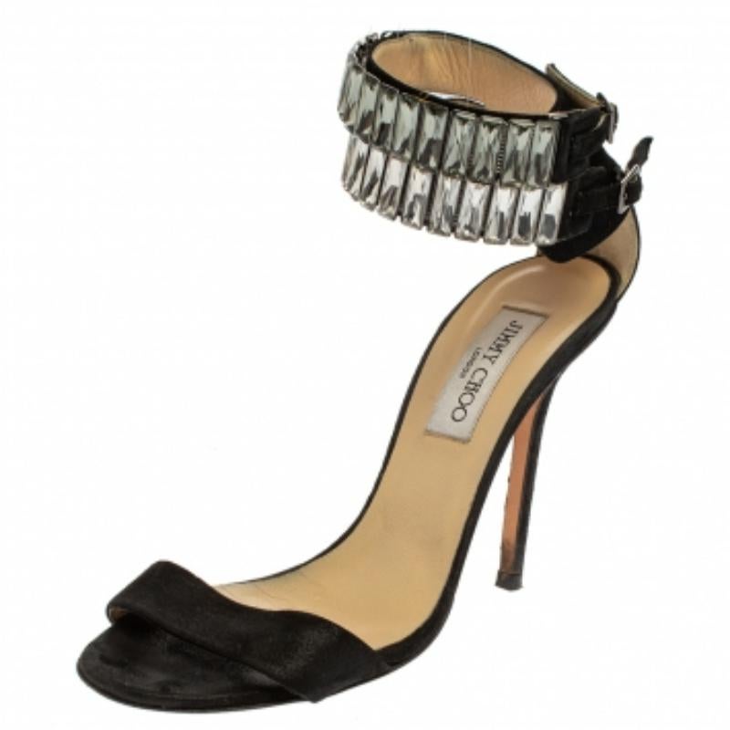 You're sure to win hearts with these sandals from Jimmy Choo as they've been purposely created to make you feel like a fashion queen. The sandals carry a frontal strap, crystal-embellished ankle cuffs with buckle fastenings, and 11.5 cm heels. They