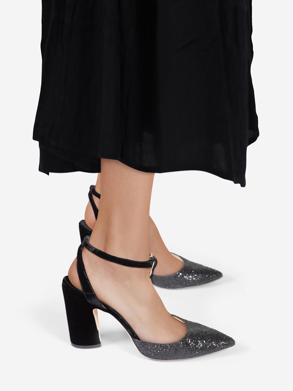 CONDITION is Very good. Minimal wear to the heels is evident. Abrasion on both heels and both toe boxes. Loss of texture to the material on both in soles on this used Jimmy Choo designer resale item.
 
 
 
 Details
 
 
 Black
 
 Glitter
 
 Heels
 
