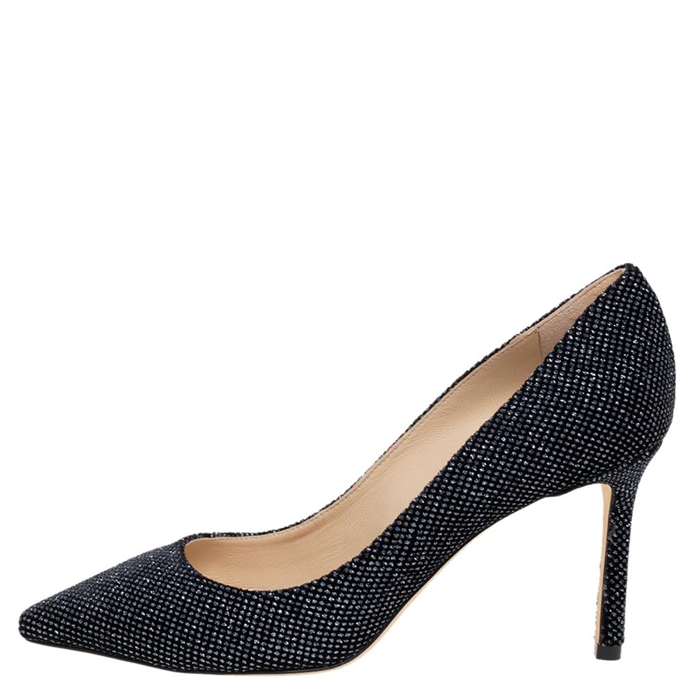 Modern, stylish, and stunning, these glamorous Jimmy Choo Romy 85 pumps are a great choice for a special occasion. Fashioned in glitter fabric, these chic pumps come with a leather sole, pointed-toe design, sleek heel that offer a leg-lengthening