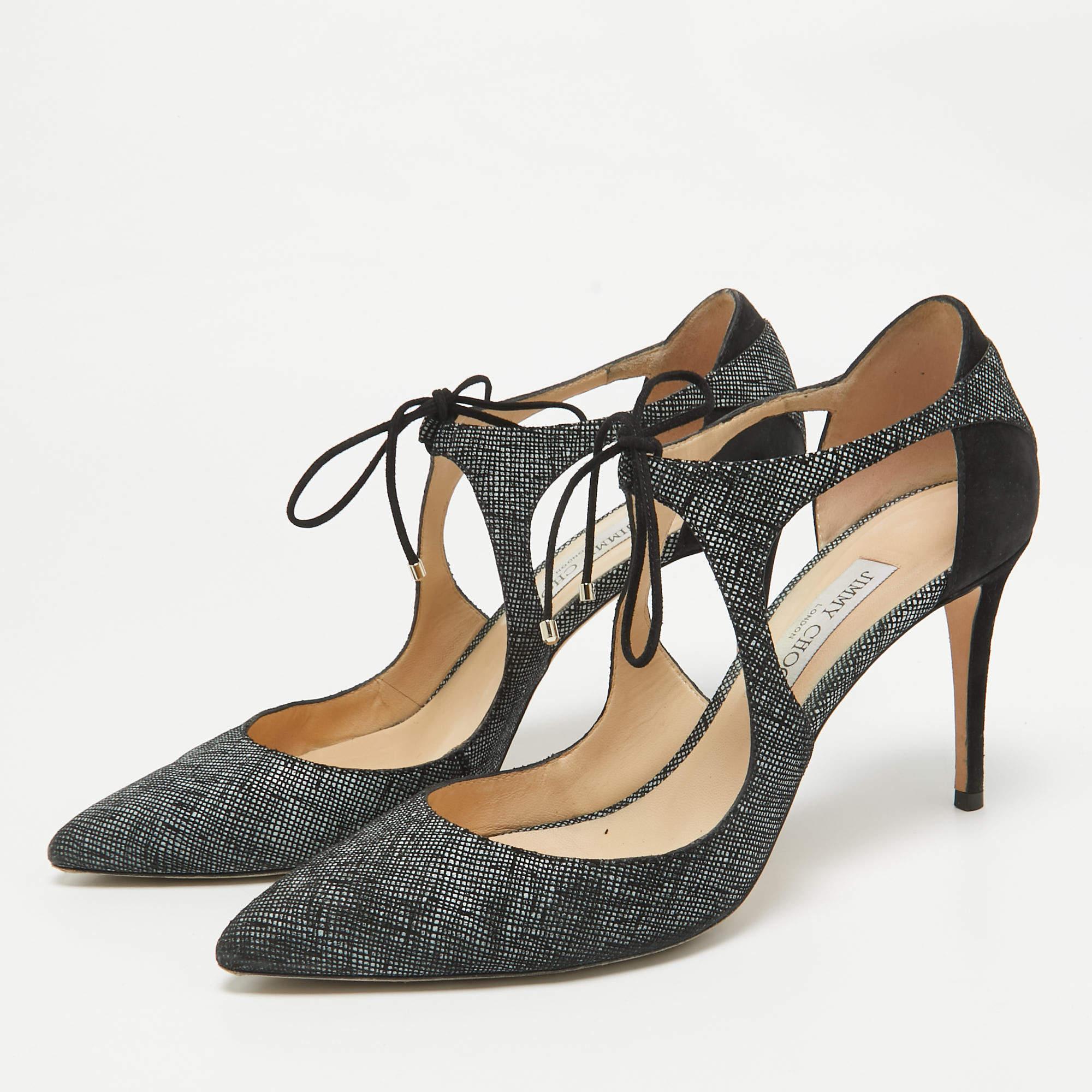 The expertly placed cuts make this pair of Jimmy Choo pumps desirable and elegant. Created from textured suede  it is styled with a lace up detail on the vamp  covered counters  and leather insoles. The heels offer these shoes a functional finish.