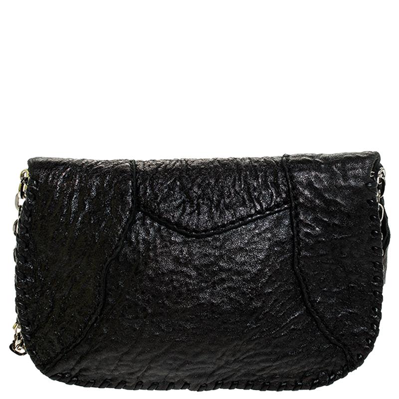 This shoulder bag by Jimmy Choo is great for evenings and parties. Crafted in Italy, it is made of quality leather and comes in a classic shade of black. It is styled with a jewel embellished front flap that opens to reveal a luxurious interior