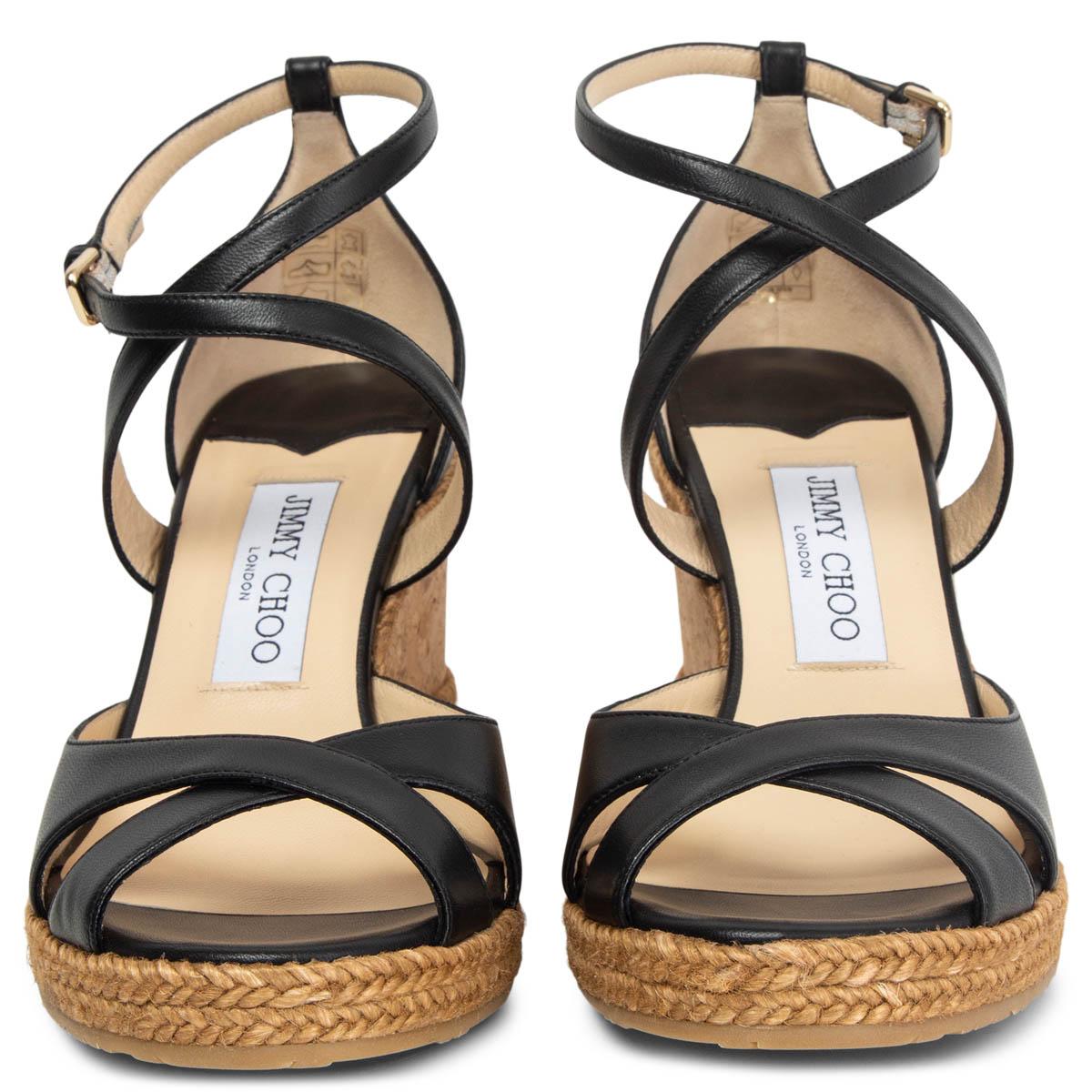 100% authentic Jimmy Choo Alanah wedge sandals in black leather with a beige cork sole. Brand new. 

Measurements
Imprinted Size	38
Shoe Size	38
Inside Sole	24.5cm (9.6in)
Width	8cm (3.1in)
Heel	8cm (3.1in)
Platform:	2cm (0.8in)

All our listings