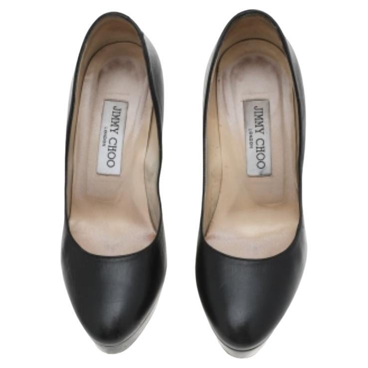 These Alex pumps from the House of Jimmy Choo are truly the best buy! They are crafted using black leather and feature rounded toes, a slip-on style, and platforms. They display towering 11.5 cm heels. These pumps will revamp your style in seconds.