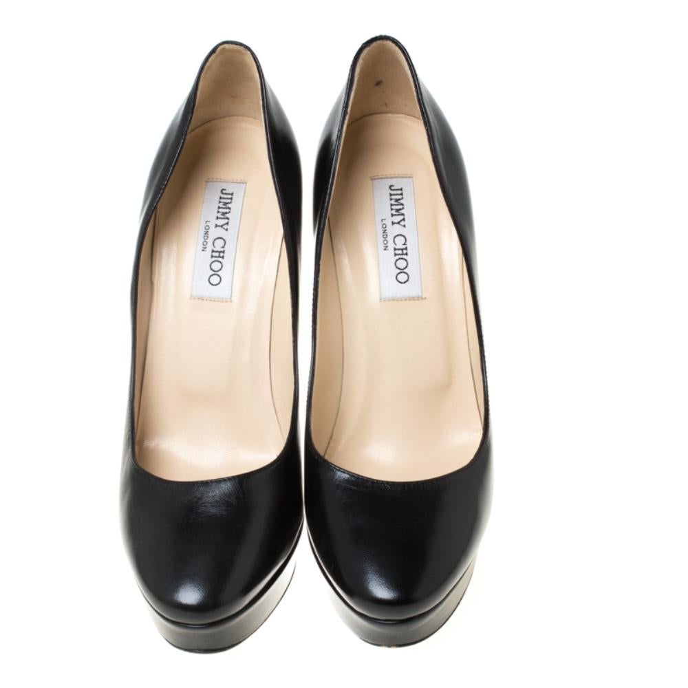 Crafted out of black leather, these pumps are a functional pick for all events. A gorgeous pair from the house of Jimmy Choo to highlight your fabulous styling choices. The black pumps feature platforms and 13 cm heels.

Includes: Original Dustbag

