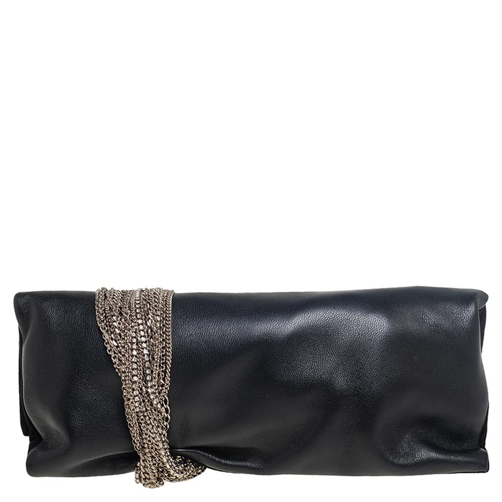Sprinkle grace and style in every swing with this Chandra clutch from Jimmy Choo. Crafted from suede and leather, the piece is styled with silver-tone chain detail that is wound around the clutch, ending as the clasp. The insides are lined with