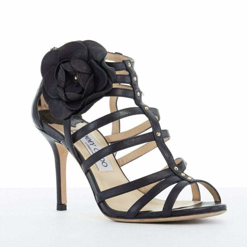 JIMMY CHOO black leather flower brooch caged strappy heel sandals EU35.5 US5.5
Reference: TGAS/A01713
Brand: Jimmy Choo
Material: Leather
Color: Black
Pattern: Solid
Closure: Zip
Extra Details: Black leather upper. 3D floral brooch applique on outer