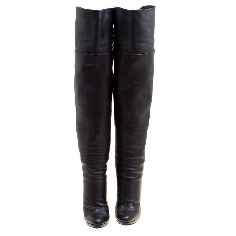 Stylish and very chic, these over the knee boots from Jimmy Choo are a must-buy for the fashionable you. These black boots are crafted from leather and feature almond toes. They come equipped with leather lined insoles, 12 cm heels, and thin