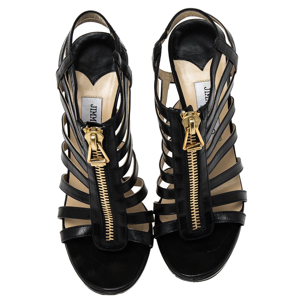 Step out in these gorgeous Jimmy Choo Glenys Gladiator sandals that are perfect to wear from day to night. They can be paired with both jeans and dresses. They feature a strappy leather exterior with a gold-tone zipper at the front. They also have