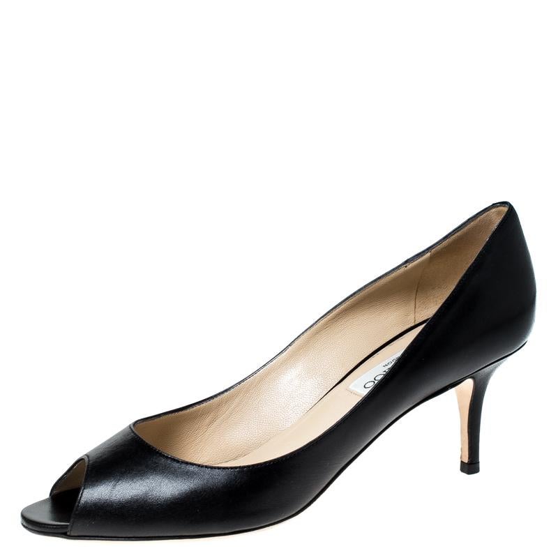 Complete your look in these Isabel pumps from Jimmy Choo. Crafted from leather, they feature peep-toes, 7 cm high heels and leather-lined insoles carrying the brand's label. Feminine and chic, these pumps will make you shine.

Includes: Original