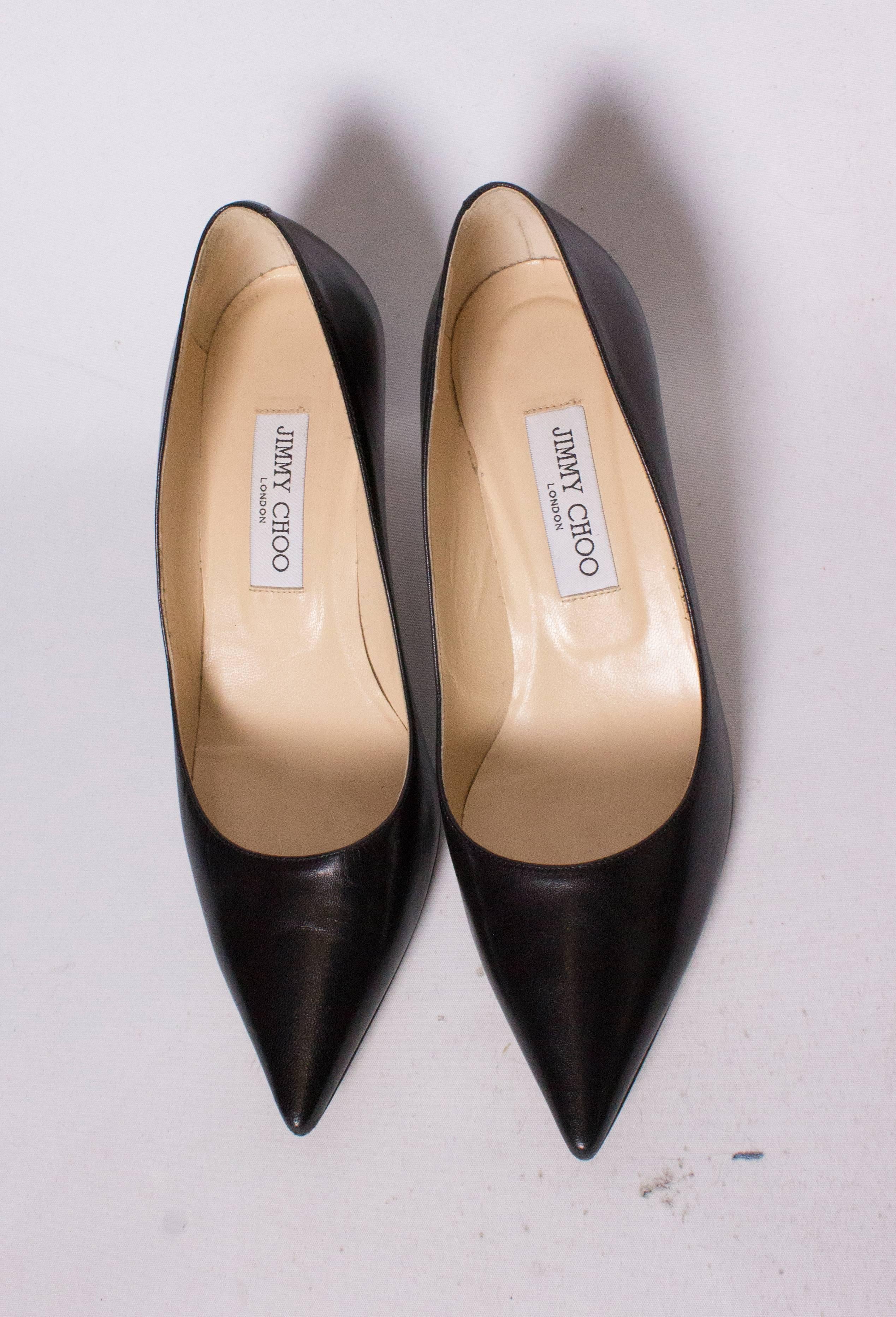 A chic pair of Jimmy Choo kitten heels. They are in black leather and in execellent condition.