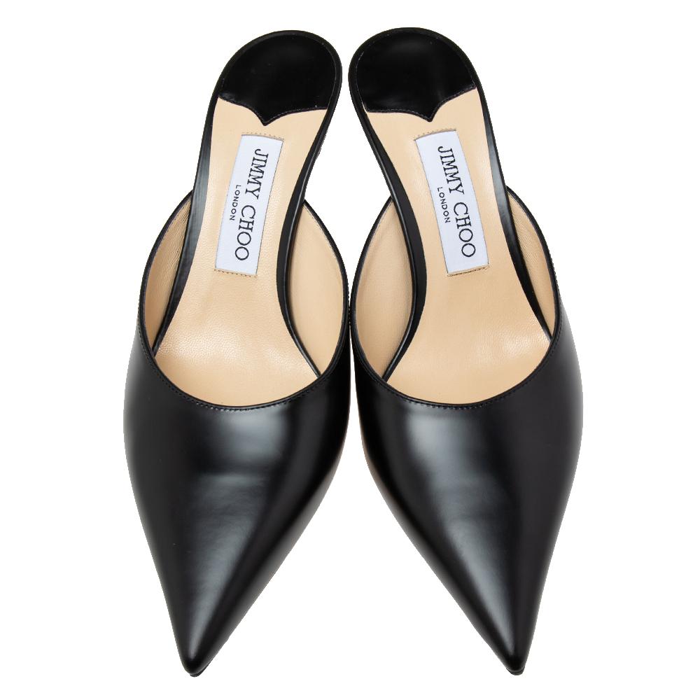 Jimmy Choo's timeless aesthetic and stellar craftsmanship in shoemaking is evident in these stunning mules. Crafted from black leather, they carry a feminine design with pointed toes and an open back. They are complete with 7.5 cm heels to lift you