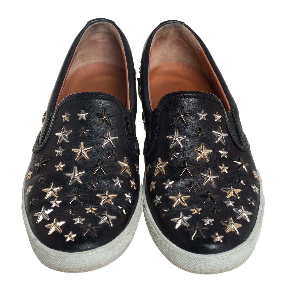 Make these stylish Jimmy Choo sneakers yours this season and project an amazing look. They are finely crafted from black leather and feature round toes and star embellishments all over. They are complete with comfortable leather-lined insoles and