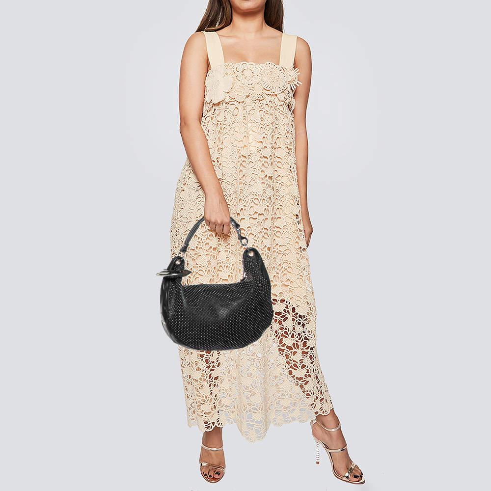 Stylish handbags never fail to make a fashionable impression. Make this designer hobo yours by pairing it with your sophisticated workwear as well as chic casual looks.