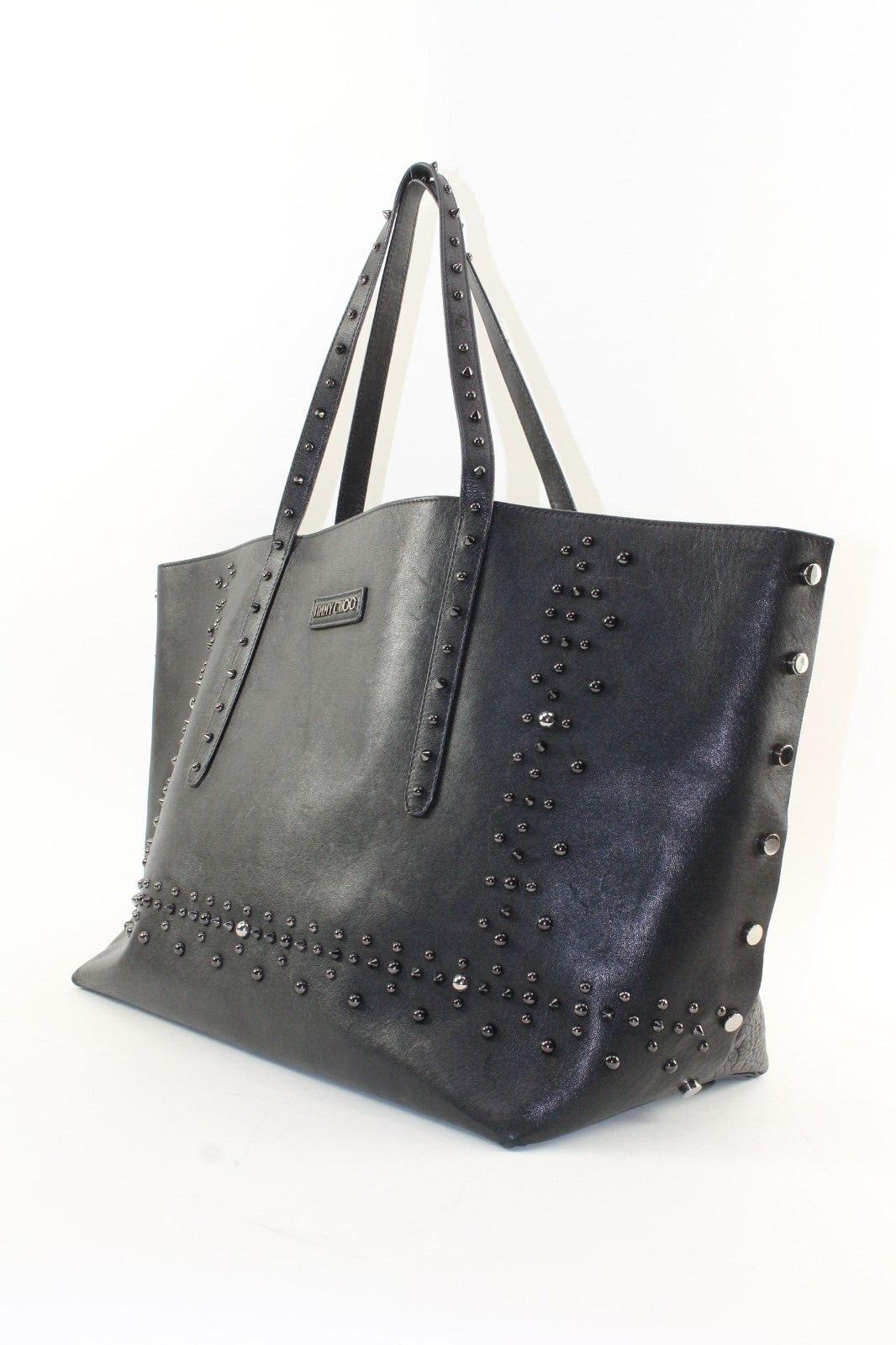 JIMMY CHOO Black Leather Studded Tote Spike Grommet Rivet 4JC1220K
Date Code/Serial Number: W6TZ4X

Made In: Italy

Measurements: Length: 16 