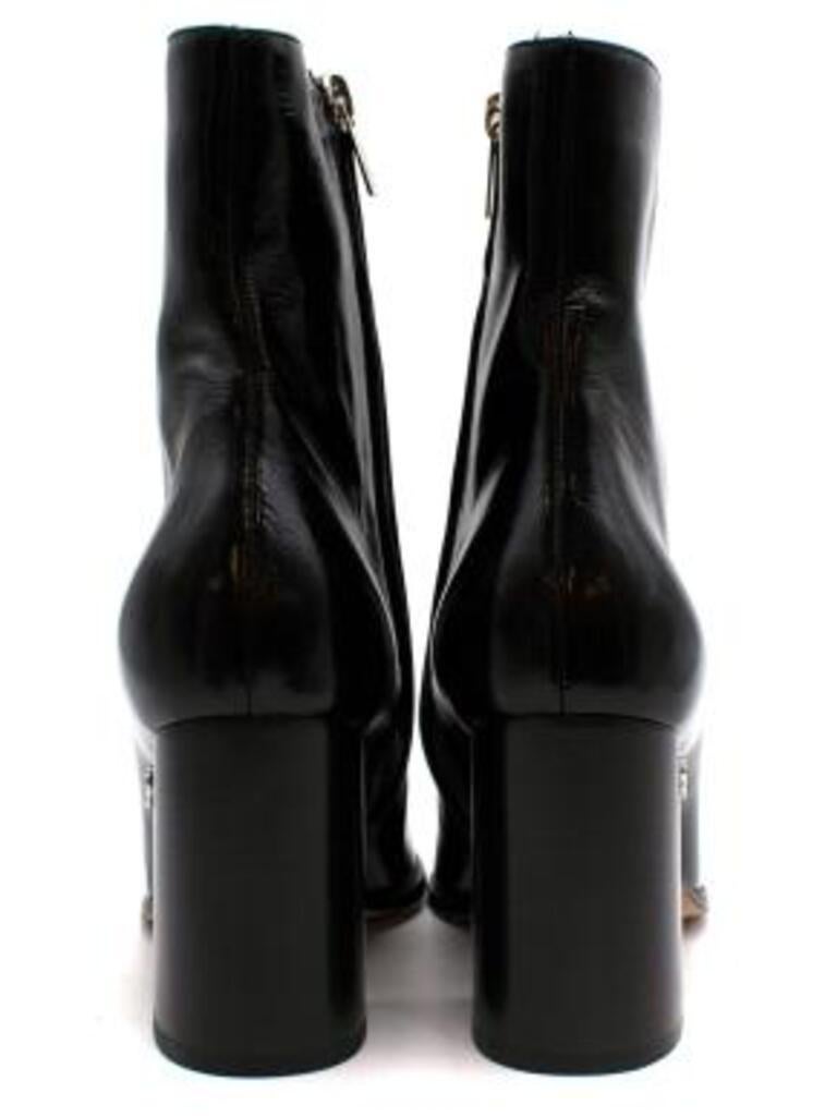 Jimmy Choo Black Patent Leather Ankle Boots with Chunky Heel
 

 - Black crinkled patent leather ankle boots 
 - Square toe 
 - Chunky square heel
 - Seam down the front 
 - Silver logo on the side of the heel
 - Zip down the inside of the foot 
 -